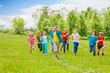 © Sergey Novikov - Boy holds big white airplane toy and kids behind