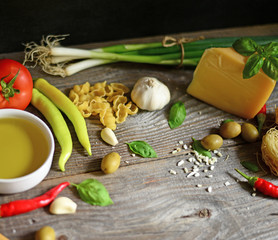 Italian and Mediterranean food ingredients on old wooden backgro