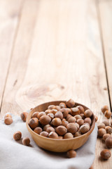 Wall Mural - Hazelnuts on wooden table