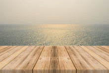 Vintage Wooden Board Empty Table In Front Of Sea & Sky Background. Perspective Wood Floor Over Sea And Sky - Can Be Used For Display Or Montage Your Products. Beach & Summer Concepts.