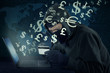 © Creativa Images - Thief stealing money with laptop and credit card