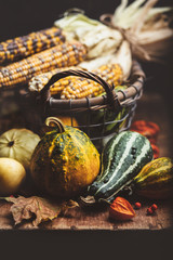 Wall Mural - corn and pumpkins on a wooden board