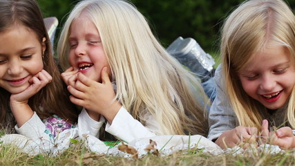 Poster - three girls resting in the park - handheld shot