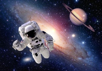 Wall Mural - astronaut spaceman suit outer space saturn planet people universe. elements of this image furnished 