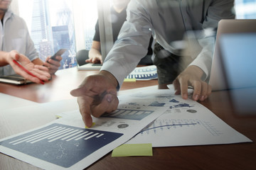 Double exposure of businessman hand working with new modern comp