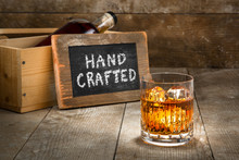 Hand Crafted Small Batch Craft Liquor Glass Bourbon Whisky Scotch Brandy Rum On Wooden Rustic Surface