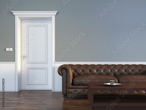 Fotografía Door with sofa in empty room interior scene