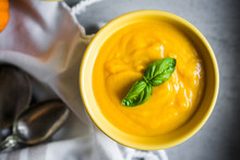 Pumpkin Soup On Rustic Background