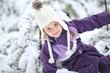© ambrozinio - Young girl fooling around in the snow in frosty day