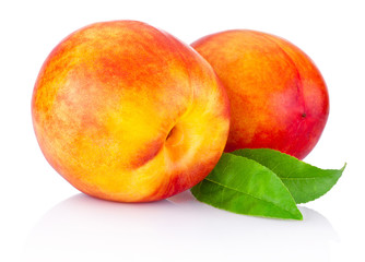 Wall Mural - Two nectarine fruit isolated on a white background