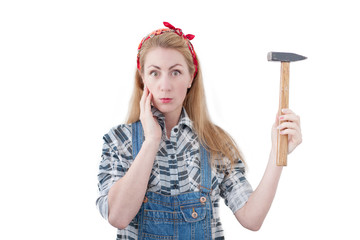 attractive young woman with a hammer and a screwdriver, and isol