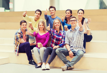 Canvas Print - group of smiling students with paper coffee cups