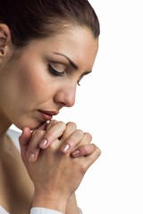 Sticker - Close-up of woman praying with joining hands and eyes closed 