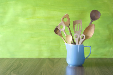 Wall Mural - rustic kitchen utensils in an old jug, good copy space on the background