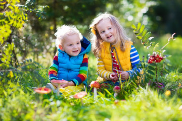 Kids playing in autumn forest