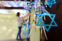 Jewish Woman Decorating Here Family Sukkah