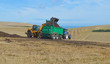 Travaux agricole : après la moisson , épandage de compost dans un champ de blé