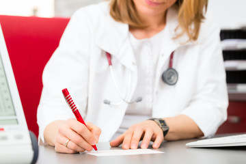 Wall Mural - Doctor writing medical certificate in practice