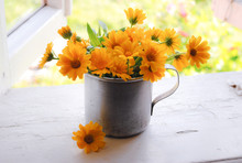 Bouquet Of Yellow Flowers In The Iron Mug