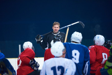 Wall Mural - ice hockey players team meeting with trainer