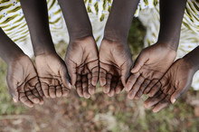 Hands Cupped Black African Children Begging Help Health Peace Education. African Black Children Hold Their Hands Cupped To Beg For Help, Health, And Peace For Their Continent.
