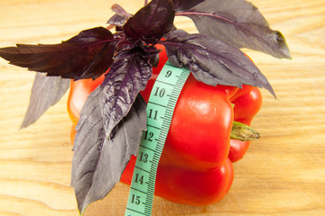 red fresh peppers on cutting board