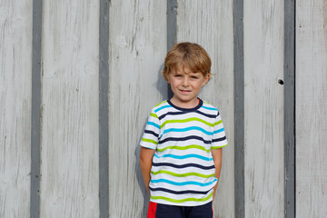 Wall Mural - happy little cute kid boy with blond hairs