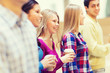 © Syda Productions - group of smiling students with paper coffee cups