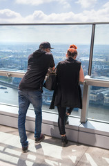 Poster - LONDON, UK - APRIL 22, 2015: Business people watching London skyline from the 32 floor of viewing hall