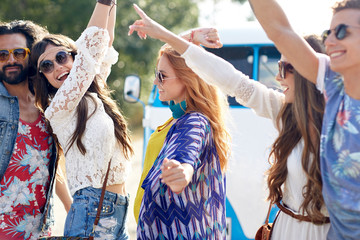 Canvas Print - happy young hippie friends dancing outdoors