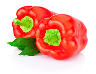 Wall Mural - Two bell Red Peppers with green leaves isolated on white backgro