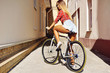 © paultarasenko - Young sexy woman back on sport fixed gear bicycle posing on outd