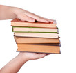 © arybickii - hand giving pile of book as a gift of knowledge