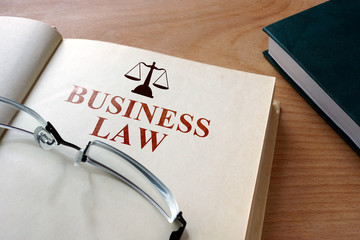 Code of  business law on a wooden table.