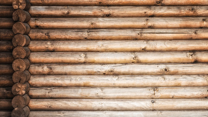 Wooden logs wall and ends of logs