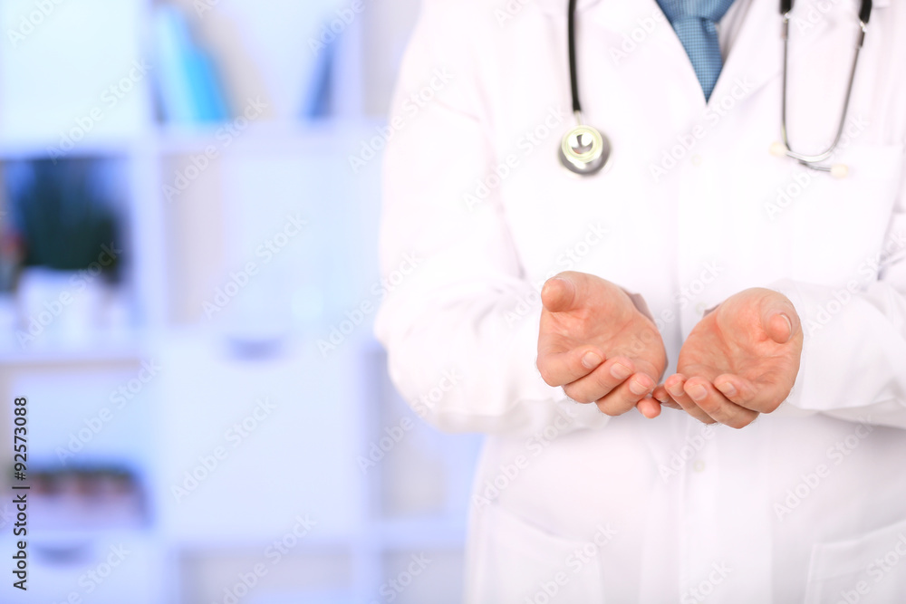 Doctor with stethoscope at his workplace