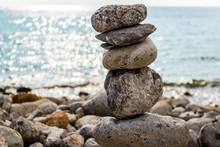 Art Of Stone Balance, Piles Of Stones On The Beach. Ibiza