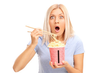 Poster - Shocked blond woman eating Chinese noodles