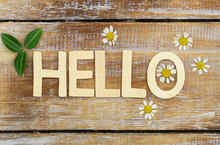 Hello Written With Wooden Letters On Rustic Surface

