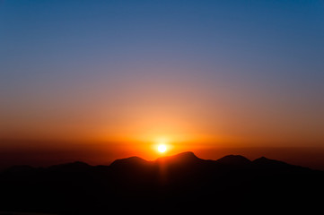 Fototapete - Sunset over Mountains