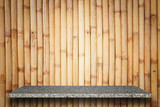 Fototapeta Fototapeta kamienie - Empty top of natural stone shelves and bamboo wall background