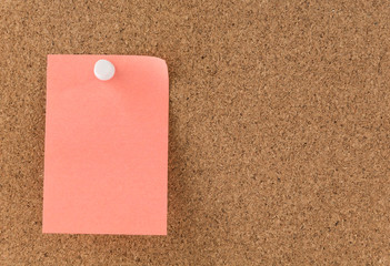 sticky note on cork board