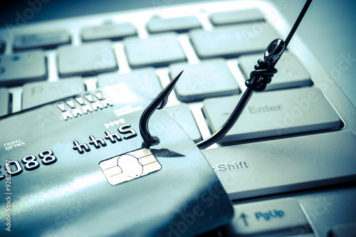 Cuadros en Lienzo La tarjeta de crédito de phishing - montones de tarjetas de crédito con un anzue