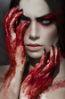 Beautiful portrait of woman with bloody hands