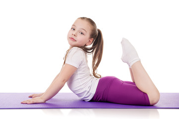 Little girl doing fitness exercises