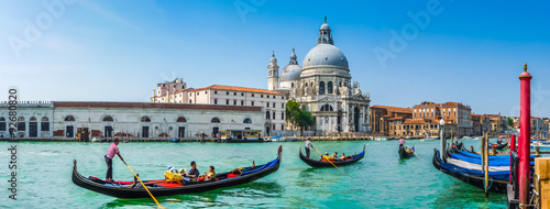 Fototapeta na wymiar Gondola on Canal Grande with Basilica di Santa Maria della Salute, Venice, Italy