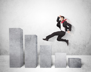 Wall Mural - Successful business man jumping over charts on background