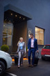 © .shock - business people couple entering  hotel