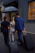 © .shock - business people couple entering  hotel