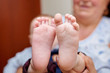 © timonko - Soft newborn baby feet